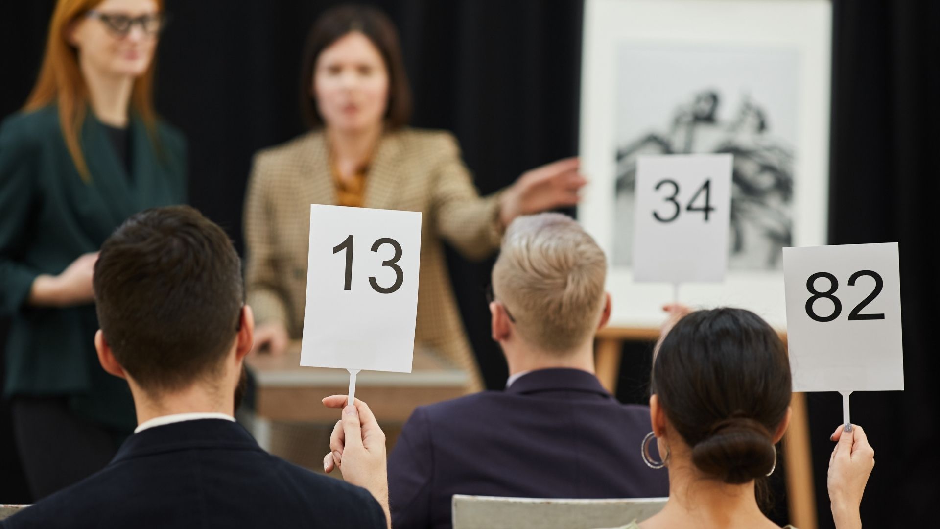 Photo of a typical art auction.